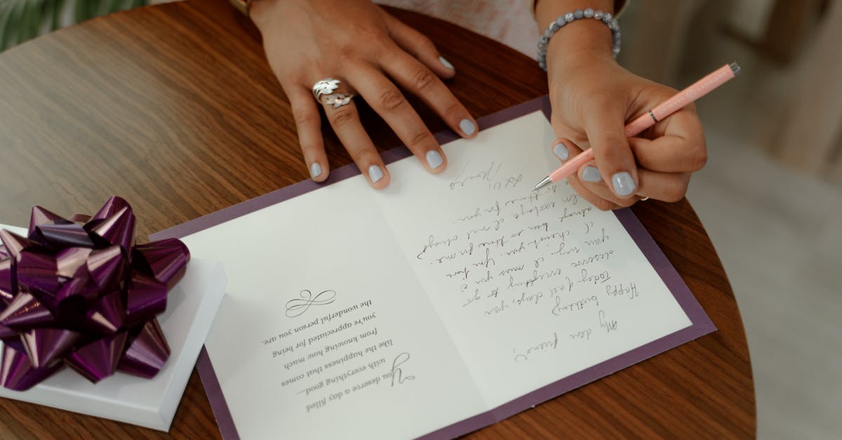 Poland invitation letter - Person writing on a White Paper 