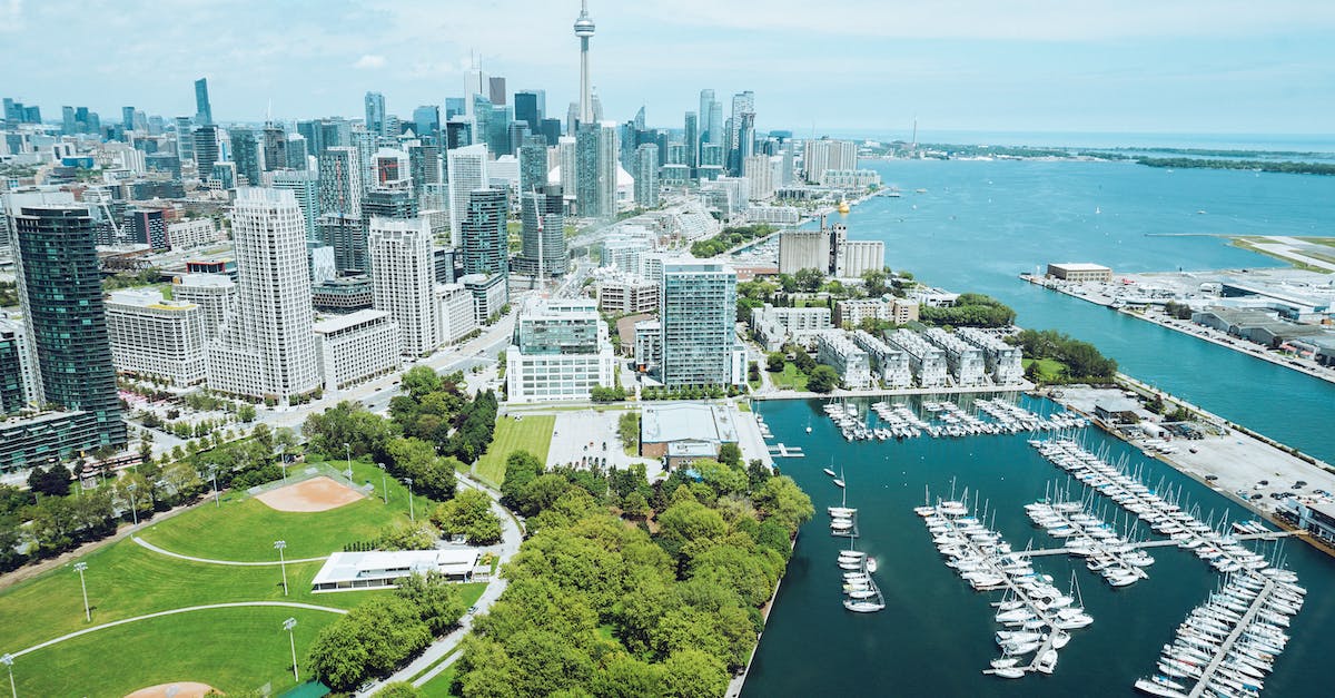 Port of Entry travelling from Toronto (Pearson) to US? - Architecture and harbor with moored boats of contemporary coastal city