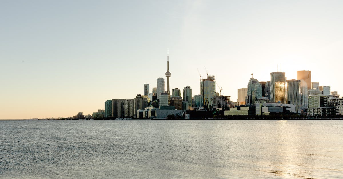 Port of Entry travelling from Toronto (Pearson) to US? - Contemporary cityscape against calm rippling seawater