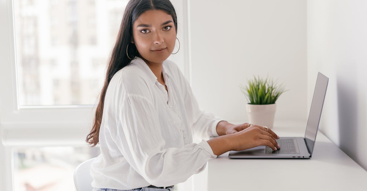 Portable Internet for Hiking? [duplicate] - Woman in White Dress Shirt and Blue Denim Jeans Sitting on White Chair