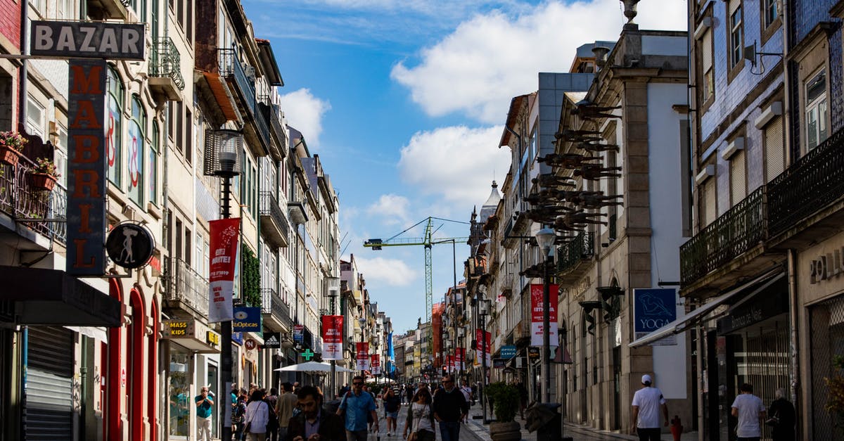 Portugal visa, business or tourism? - Photo of People Walking on Street Near Buildings