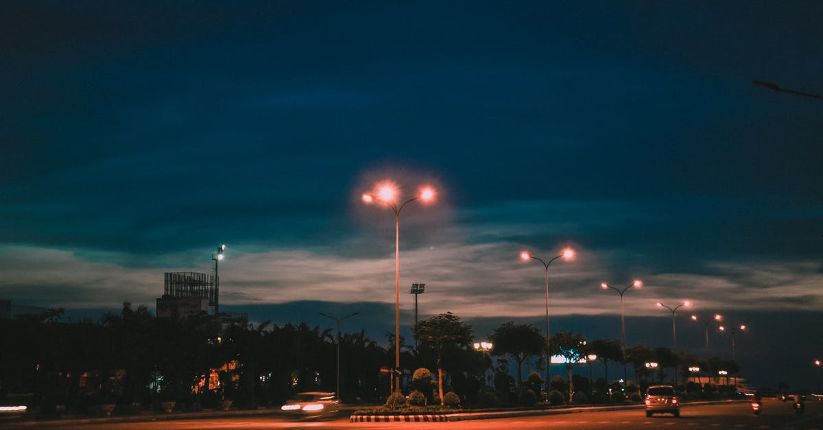 Portuguese gendarmerie cars with continuous blue lights - Vehicles on Road Near Lampposts