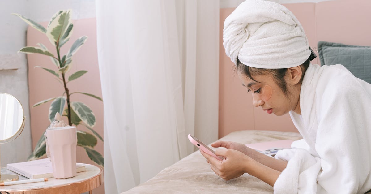 Portuguese phrasebook using IPA - Woman in White Hijab Holding Smartphone