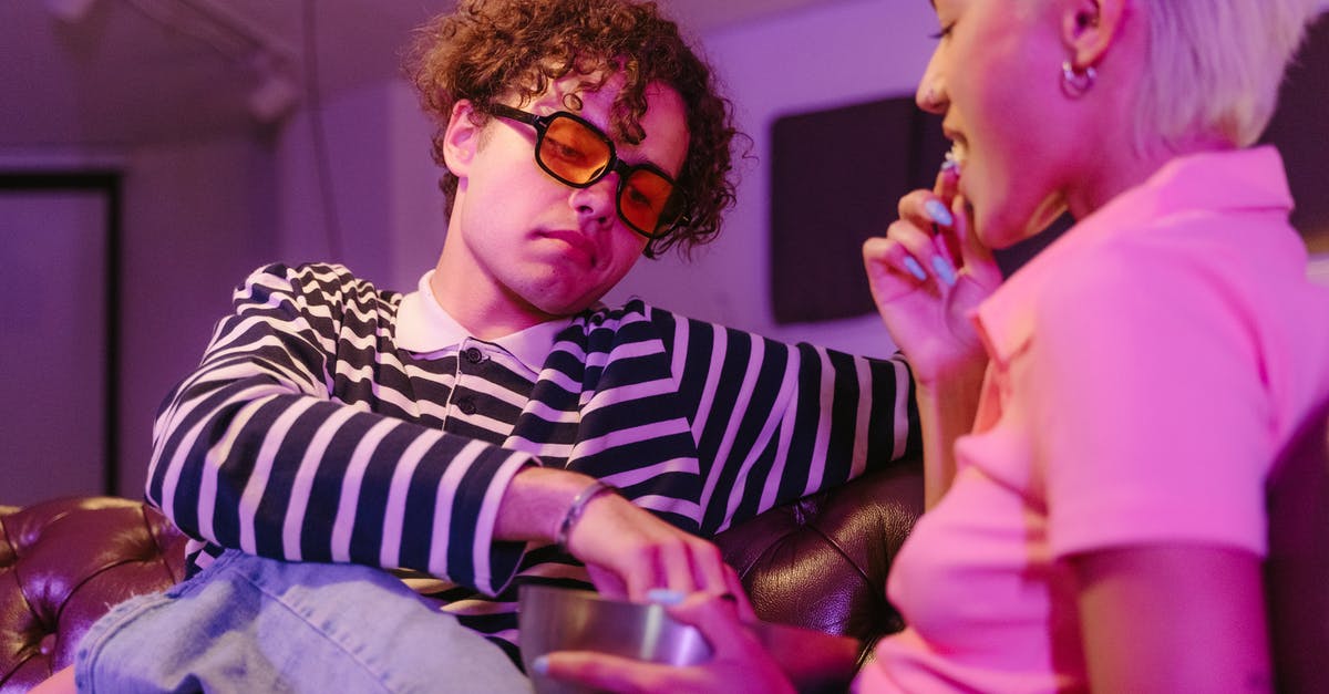 Possibilities of getting the visas processed on time - A Man with Curly Hair Wearing Sunglasses