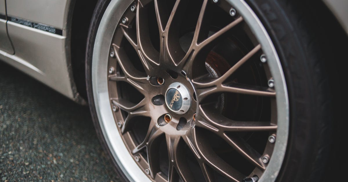 Possibility to cancel part of a trip Lufthansa and DB [closed] - Closeup of chrome wheel disk of stylish retro automobile parked on asphalt concrete road