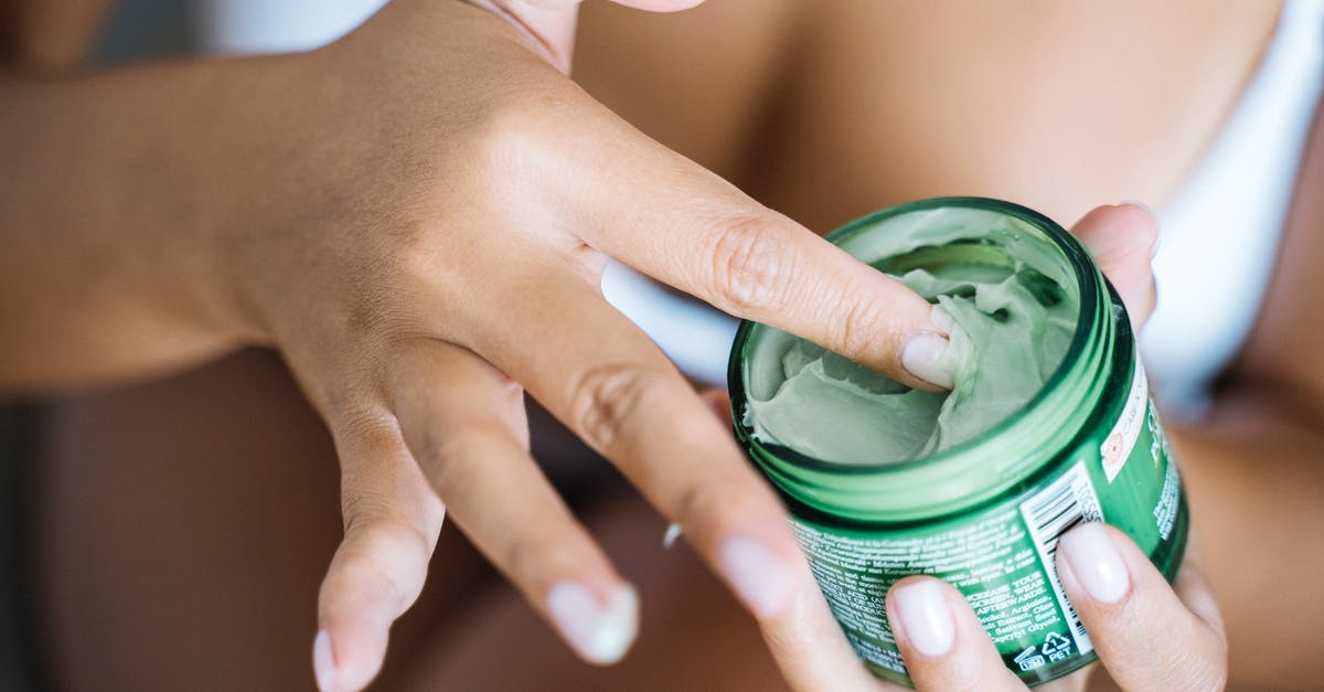 Potential downsides to getting a Polish passport? [closed] - Person Holding Green and White Plastic Cup