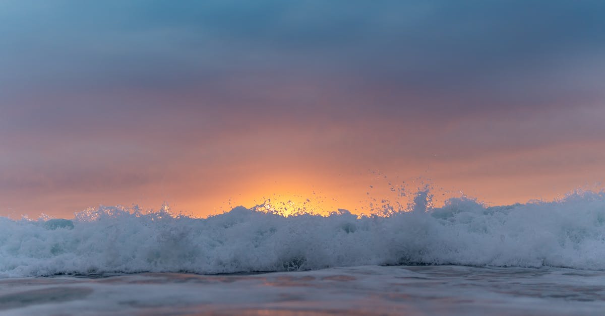 Power sockets in Ecuador - grounded or ungrounded? - Sunset sky over waving sea washing shore