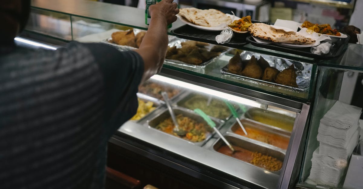 Practical food to take on flight without anything served? - Person taking tin can with carbonated beverage