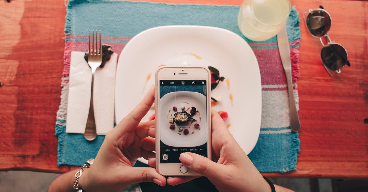 Practical food to take on flight without anything served? - Person Holding Iphone 6