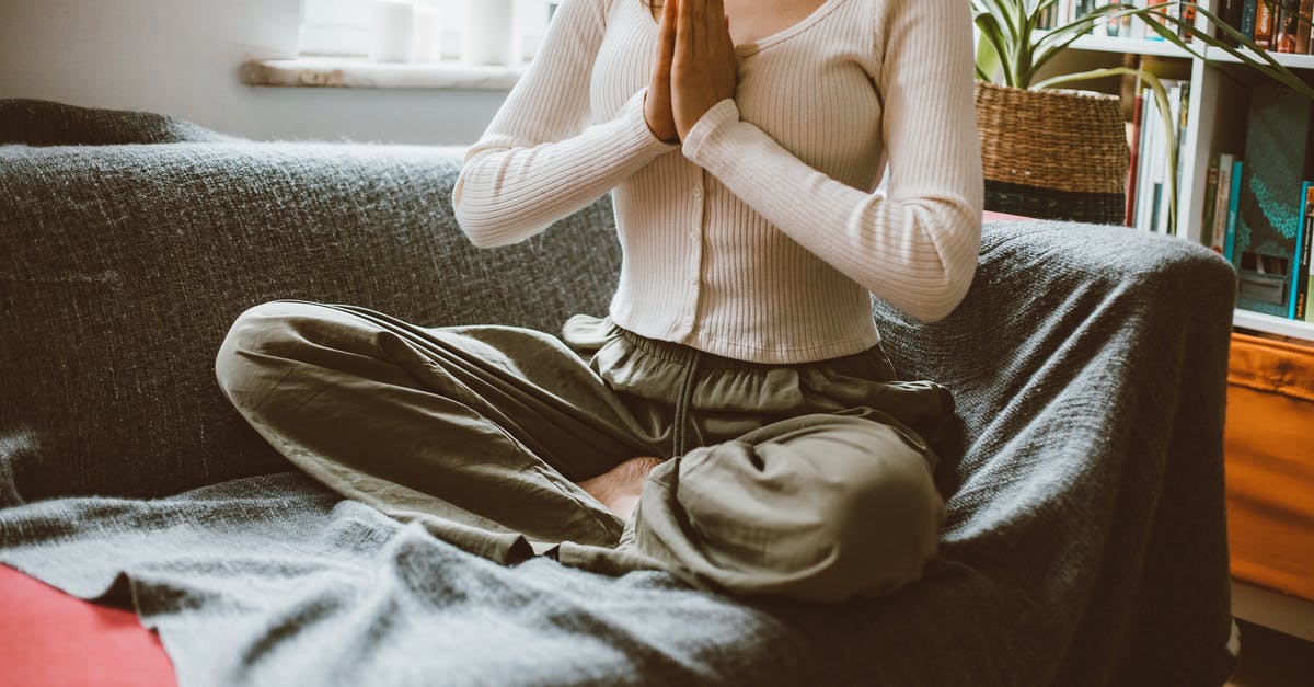 Practicing Mongolian pronunciation before visiting Mongolia [closed] - Woman Sitting on Sofa Meditating