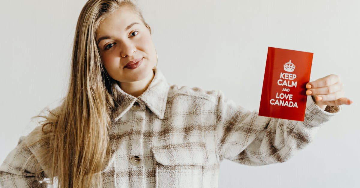 Prepaid SIM card for short term - Canada [duplicate] - A Woman Holding a Red Card with Message while Smiling at the Camera