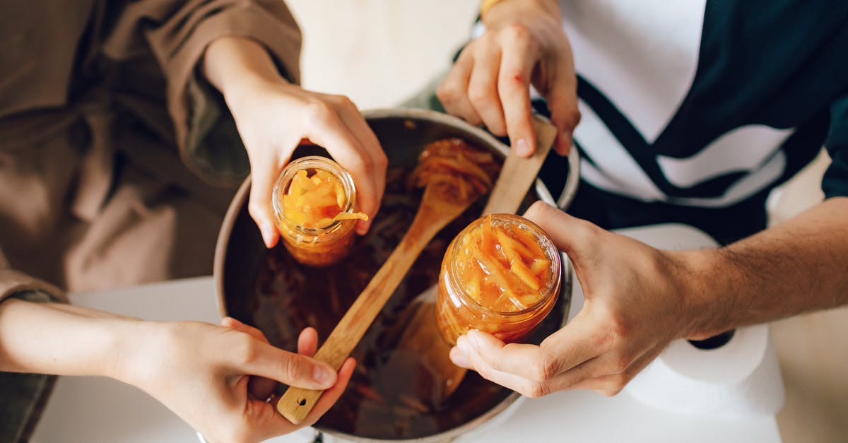 Preparing food yourself in hostels in Vienna? - Close Up of Woman and Man Hands Preparing Orange Jam