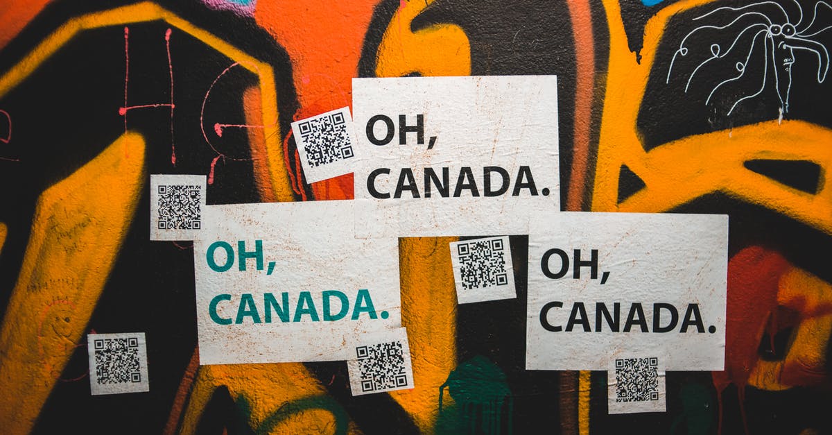 Printed Ryanair boarding pass has no QR code - Colorful graffiti wall with Oh Canada inscription and QR codes on city street