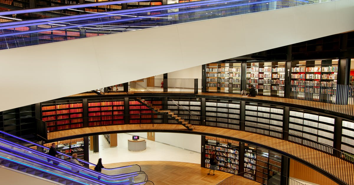 Problems associated with booking flights inside another set of flights? - Interior of modern library with escalators