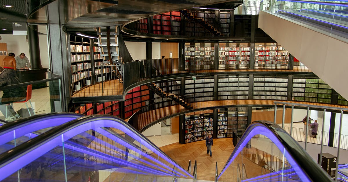 Problems associated with booking flights inside another set of flights? - Escalator in modern public library