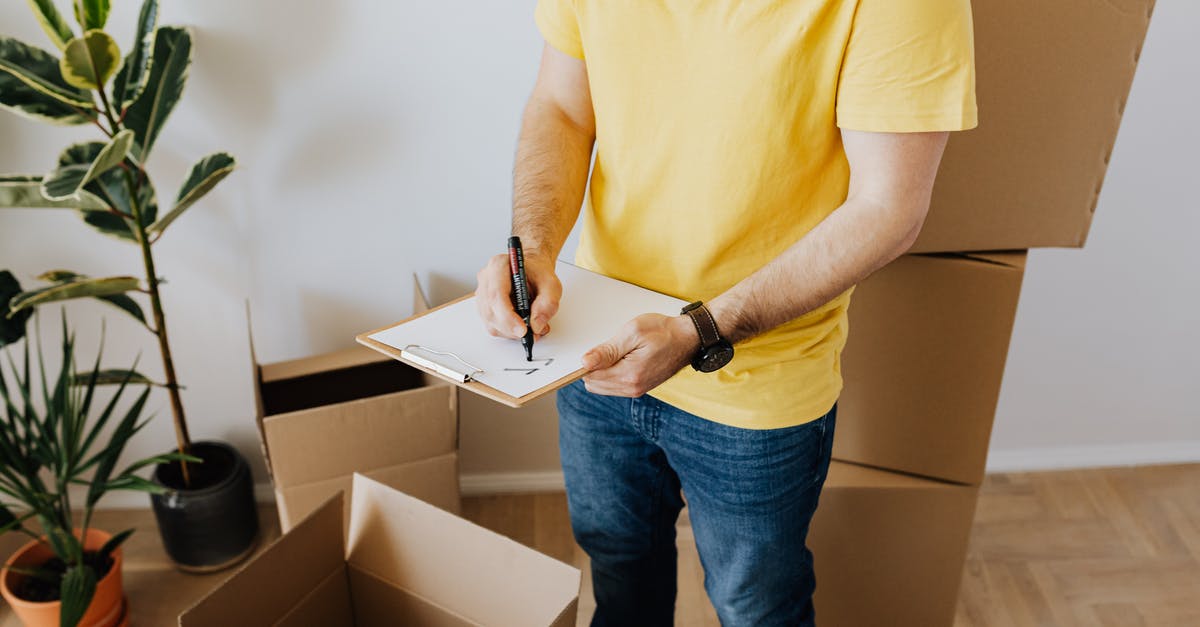 Prohibited Parcel Items from the UK to Ukraine [closed] - Crop man taking notes in clipboard while relocating