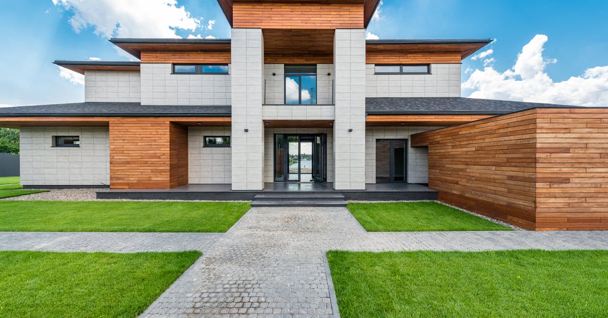 Proof of Accommodation in England - Contemporary villa against cloudy blue sky