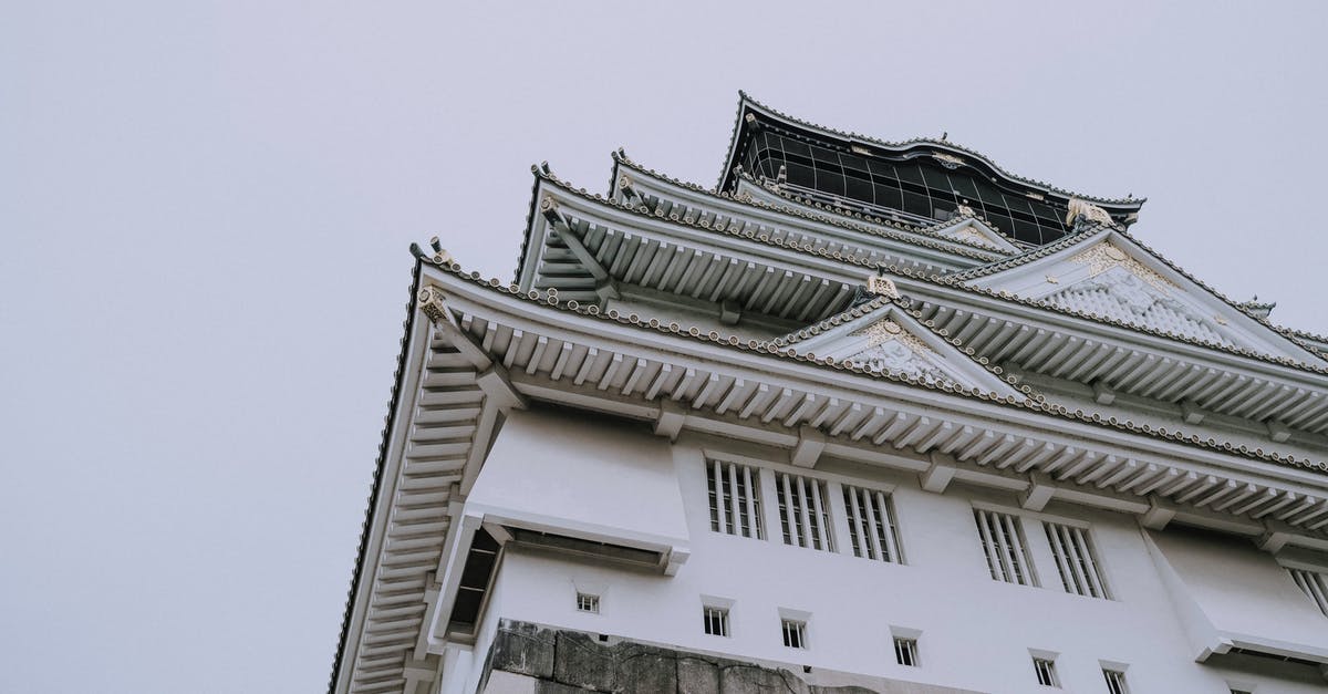 Proof of onward travel in Japan? - White and Black Concrete Building