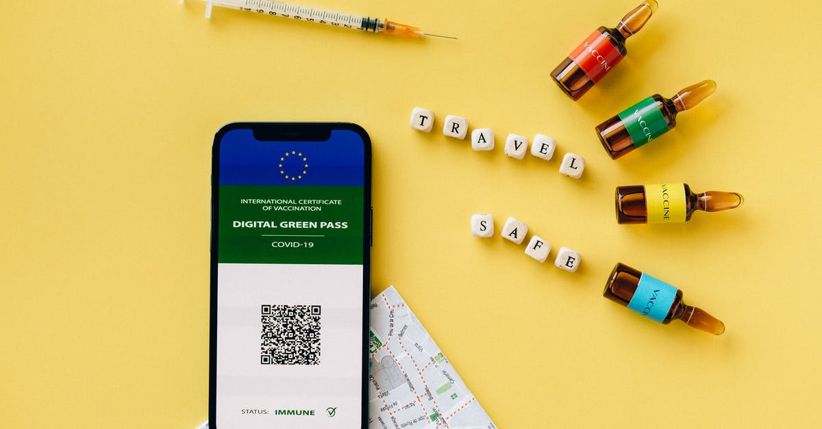 Proof of vaccination for entry to EU - Vaccine Ampules and a Smartphone