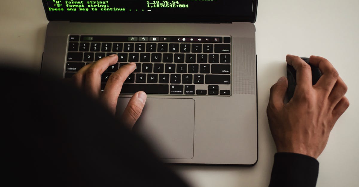 Protect laptop (and fellow passengers) from turbulence? - Crop faceless programmer working on laptop in studio