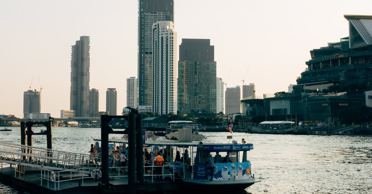 Proving onward travel on a South America tour - White Boat on Water Near City Buildings