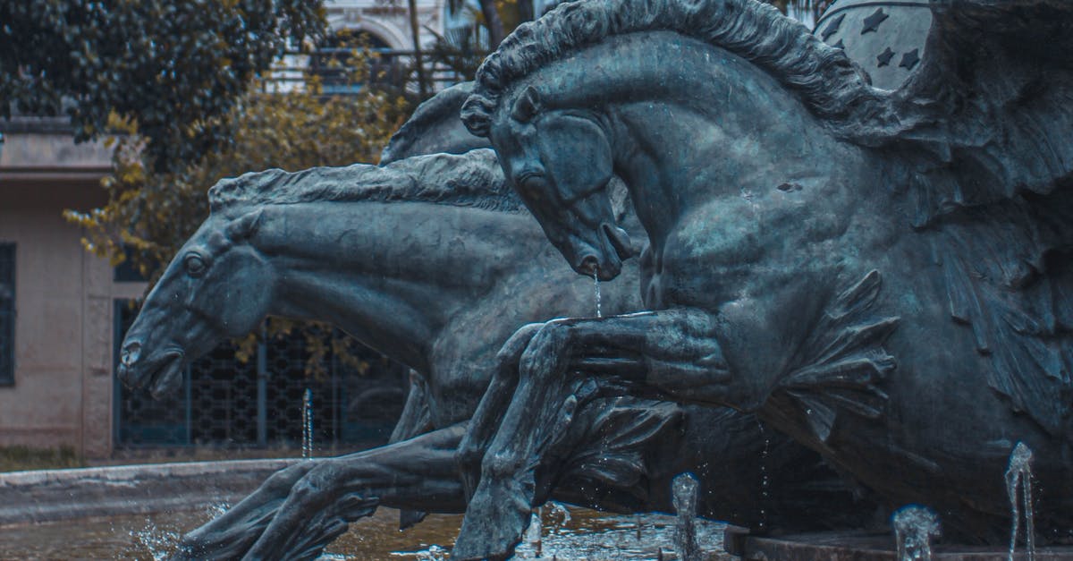 Public bus from Oruro to Sajama National Park [closed] - Sculptures of running horses in fountain with splashing water in fountain located in city park