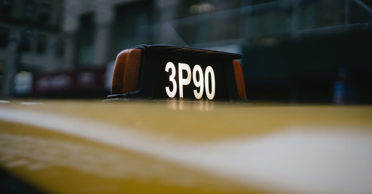 Public transport access to Pyrenees (GR10) - Modern yellow taxi roof with number sign on black background