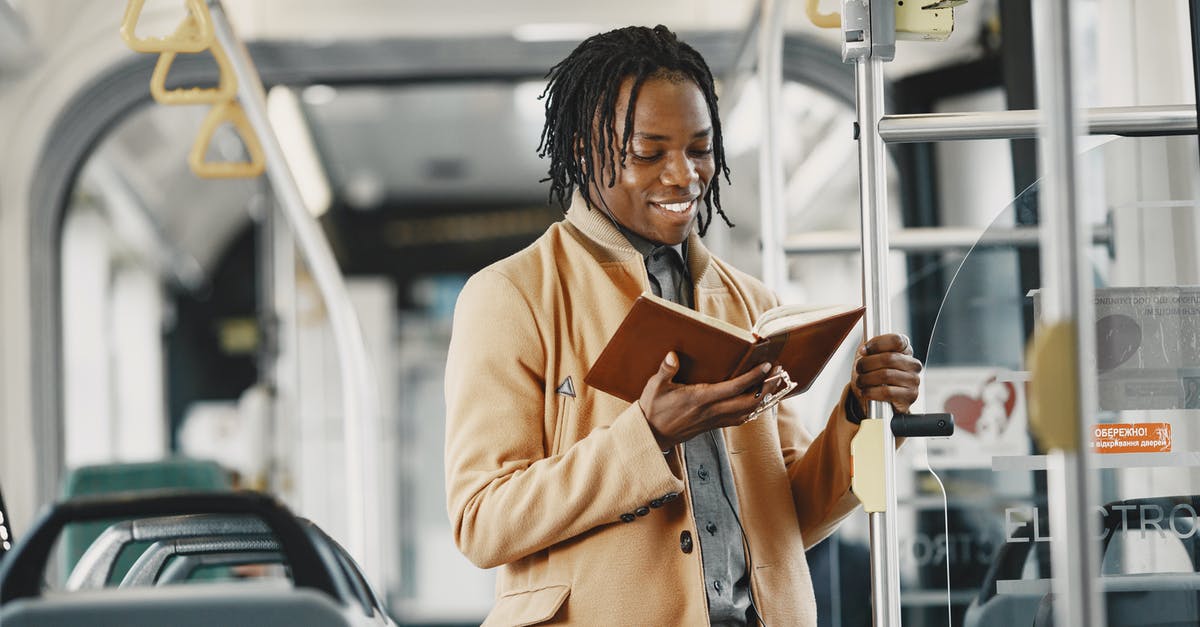 Public Transport planner for Hanover (Hannover)? - Man Reading Book in Public Transport