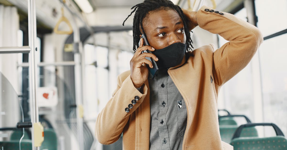 Public Transport planner for Hanover (Hannover)? - Young Man in Face Mask Talking on Phone in Bus