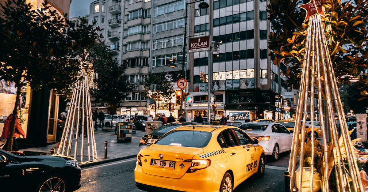 Public transport services during Christmas period in New Zealand - Taxi car and vehicles driving on city road