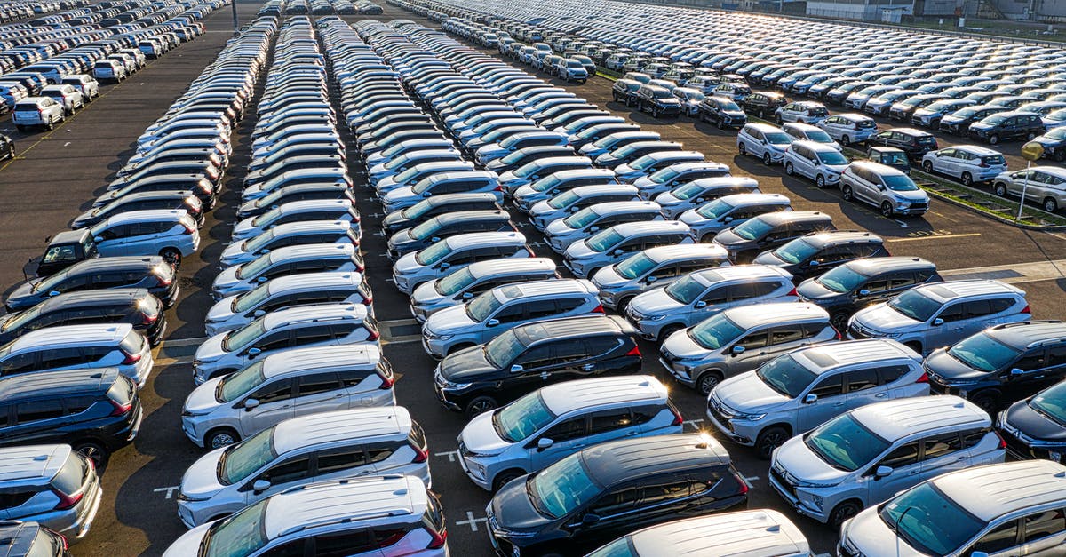 Public transport services during Christmas period in New Zealand - Rows of expensive modern cars on asphalt parking of manufacture