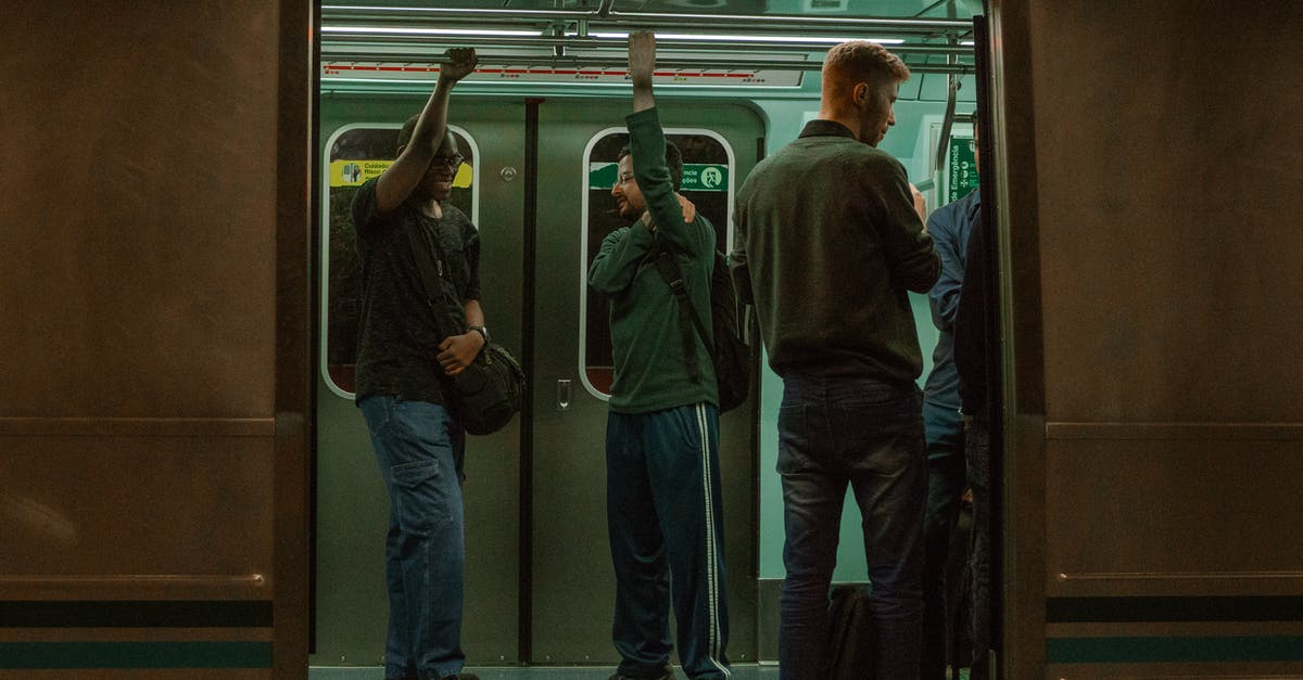 Public transportation from La Paz to Mt. Chacaltaya - People in a Gray Train