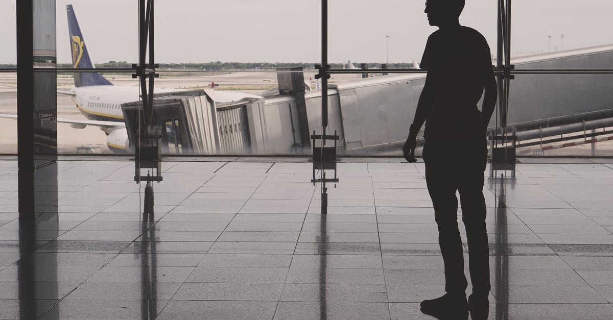 Puerto Rico Atlanta Airport non-US traveler - Silhouette of Man Inside Concrete Building