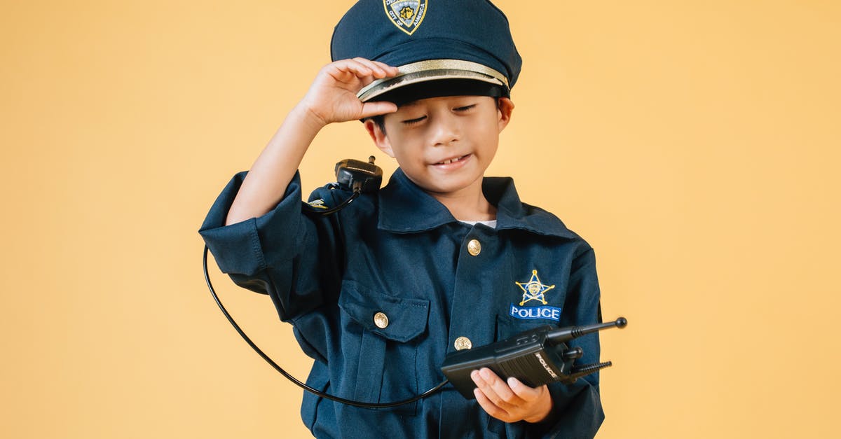 Purpose of the 'Witches' Hats' on the A13 in London - Ethnic kid in police uniform in studio