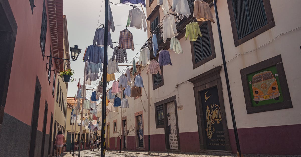 Quality travel clothesline that is easy to hook on shower stalls? - White and Pink Concrete Building