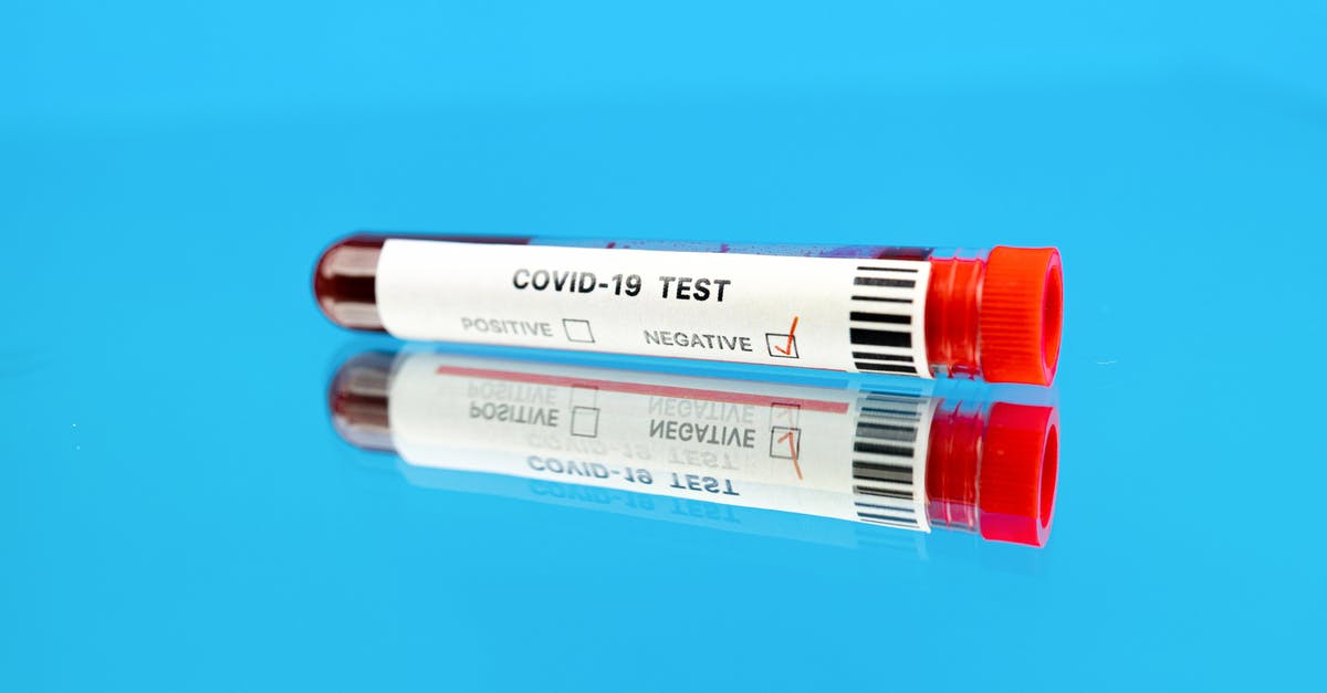 quarantining in the UK pending negative COVID-19 PCR test results - 
A Close-Up Shot of a Blood Sample in a Test Tube