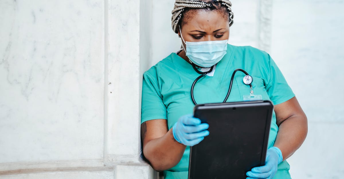 Quarantining process in JFK/NYC? - Focused woman with documents in hospital