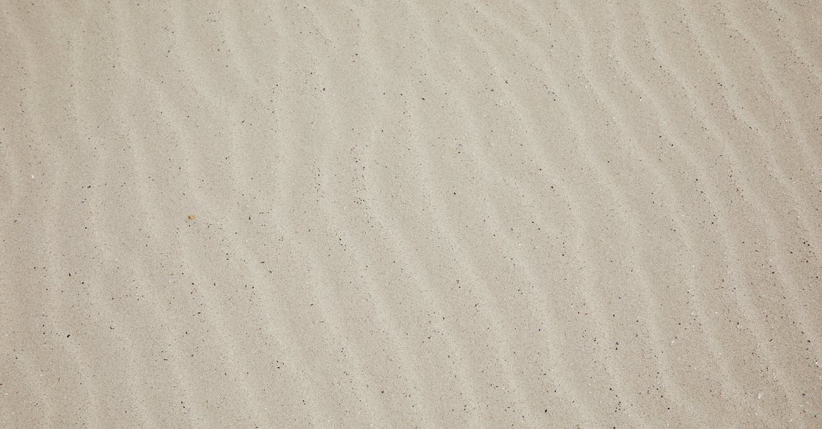 Quer-durchs-Land-Ticket valid from/to Venlo - Top view of empty dry plain surface of beach covered with sand in daytime