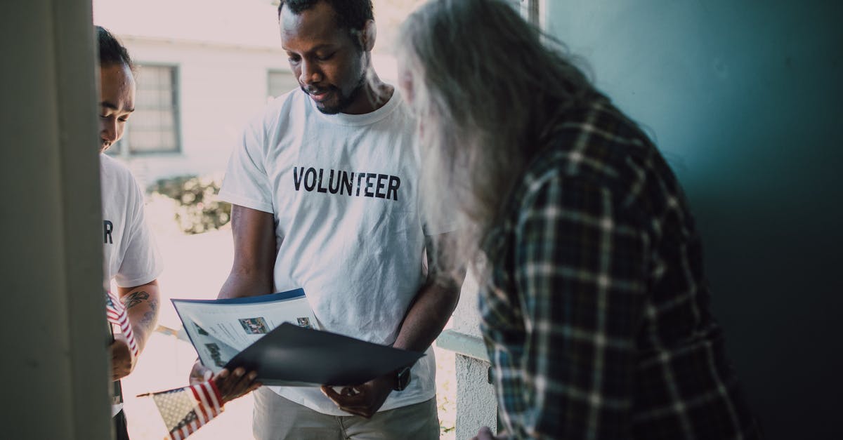 Questions about personal interview for Dutch Schengen visa - Man in White Crew Neck T-shirt Standing Beside Woman in Black and White Checkered Dress