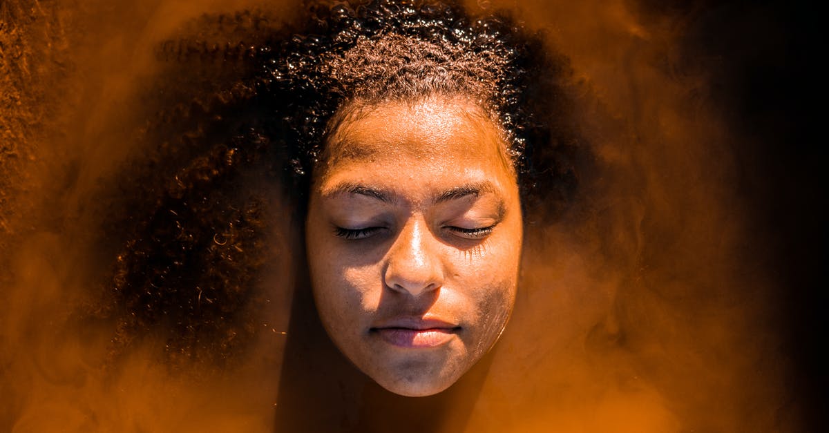 Quiet beach near Istanbul [closed] - Young black woman with eyes closed relaxing in sea water