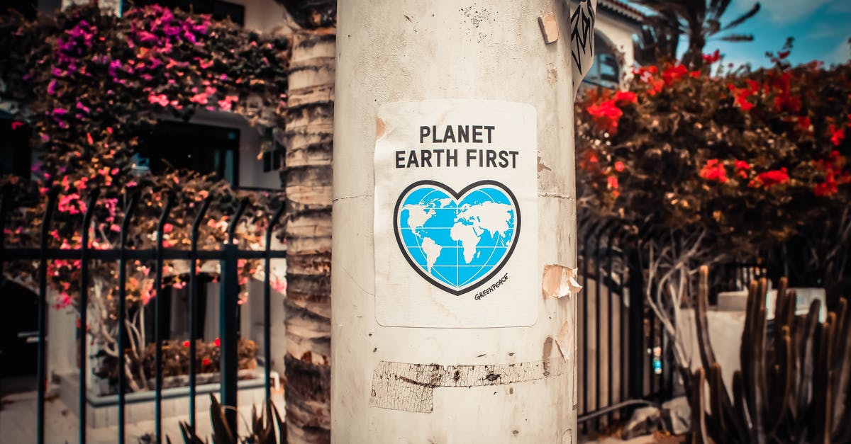 "Cancel for any reason" travel insurance - Planet Earth First Poster On A Concrete Post