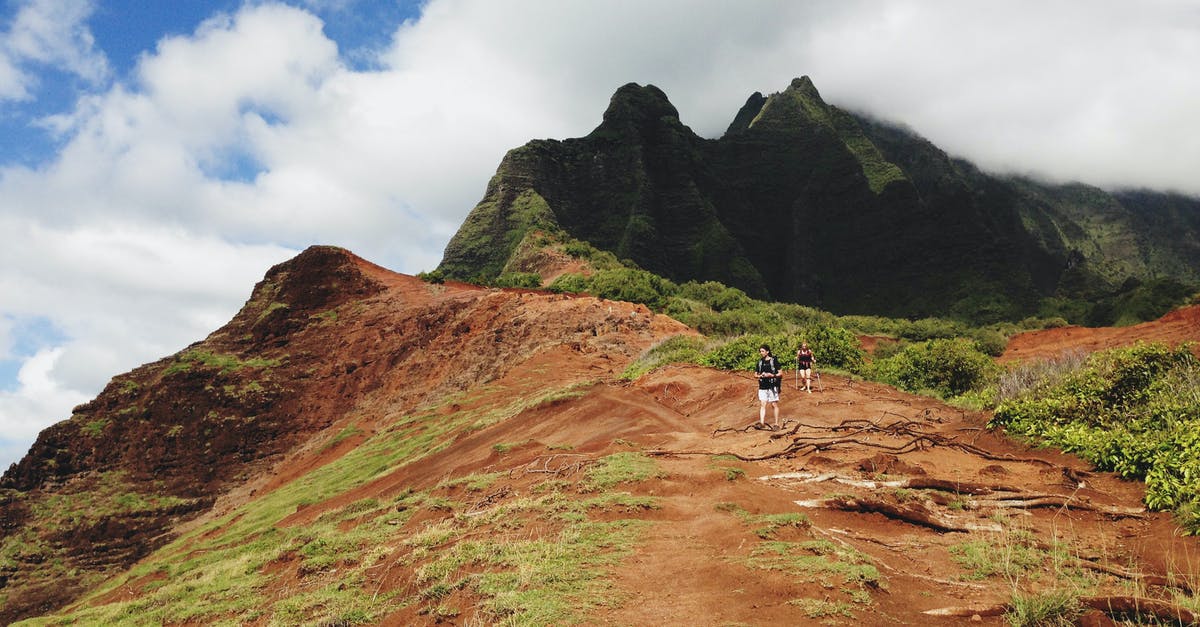 "Circular" hiking trails in Iceland? - Two People Standing on Mountain Under White Sky