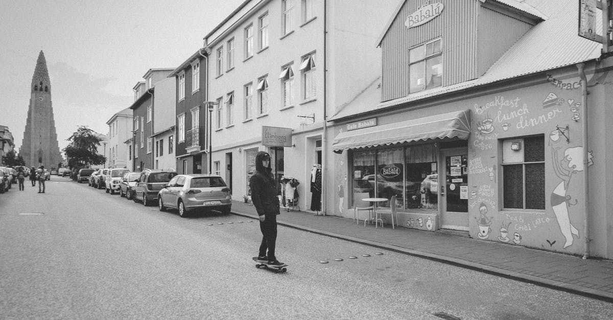 "Match of the century" in Reykjavik - Grayscale Photo of Man Walking on Street