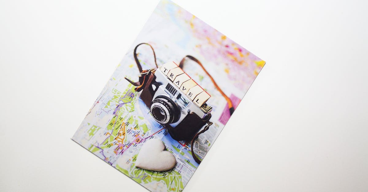 Railcard and Oyster card for traveling in London/England - Silver Camera Photograph Placed on Surface