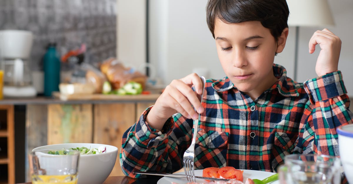 Ramen eating etiquette - Kid in Plaid Long Sleeves Eating Breakfast