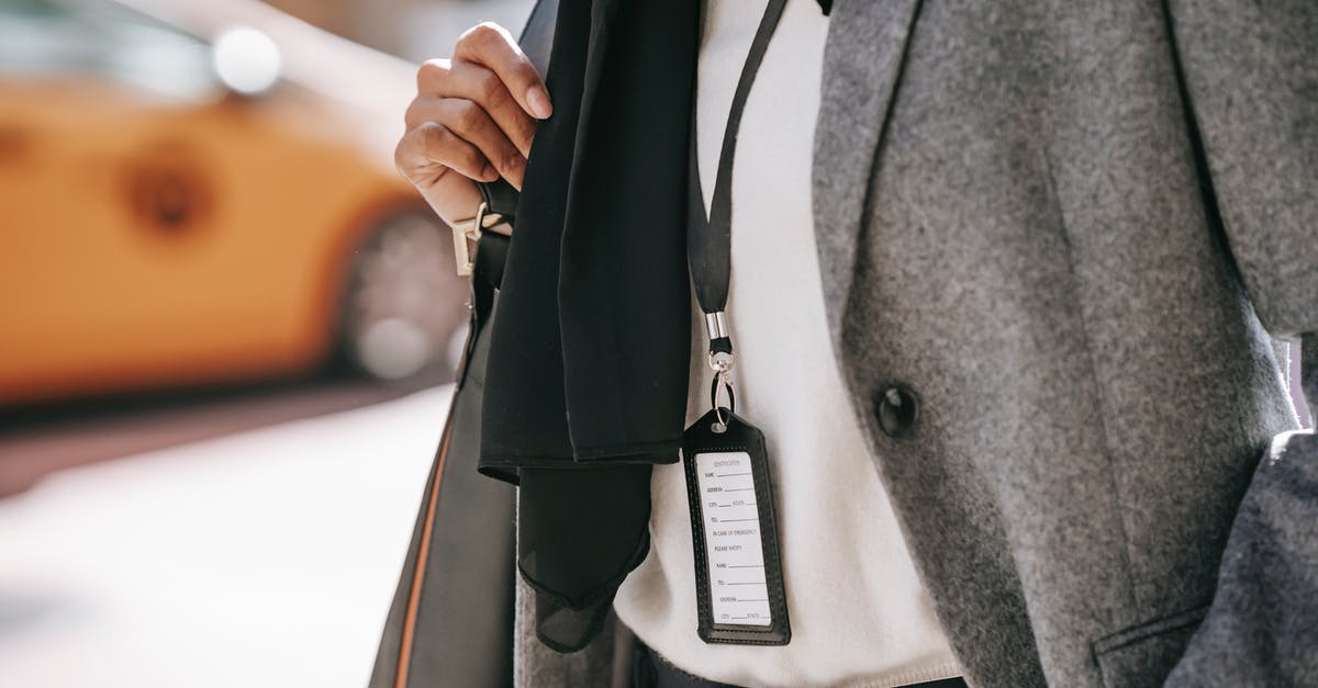 Random leather badge / tag - Anonymous stylish businesswoman walking on city street