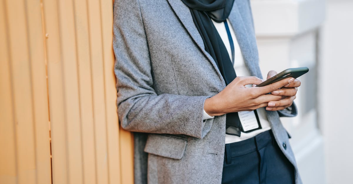 Random leather badge / tag - Crop stylish lady messaging on smartphone during break