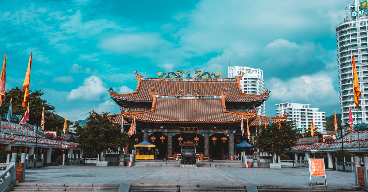 Rebooking fee for Air China - Brown and White Temple Under Blue Sky