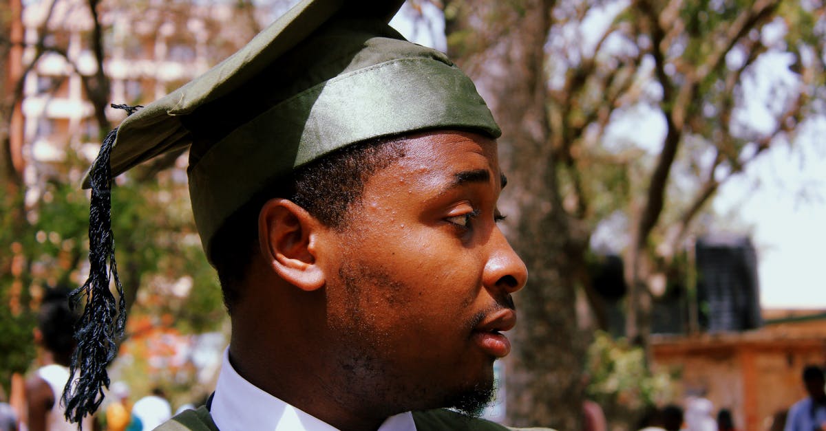 Recognised Graduate visa (subclass 476) and iBT for Australia? [closed] - Close-Up Photo of a Man Wearing Green Academic Dress