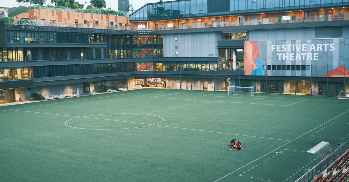 Re-entering Singapore on a multiple-entry visa - People Playing Soccer on Green Field